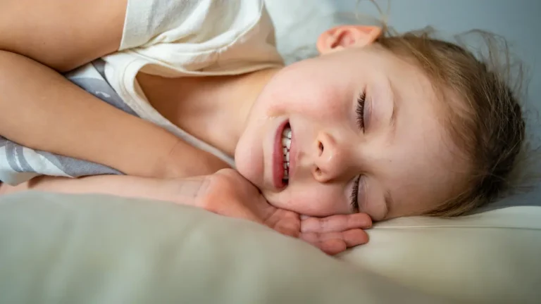 Child sleeping with clenched teeth at night