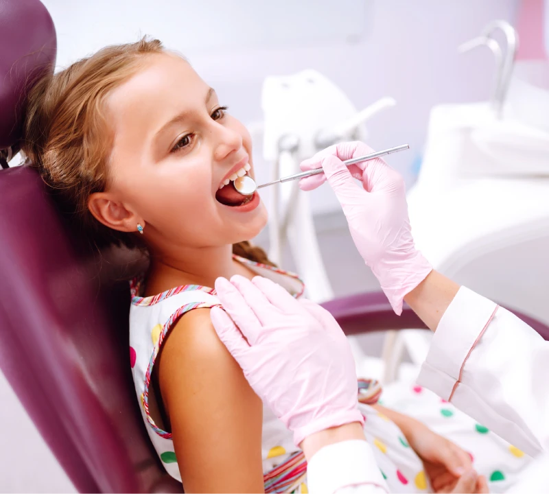 Child having a gentle dental checkup in Jumeirah Park