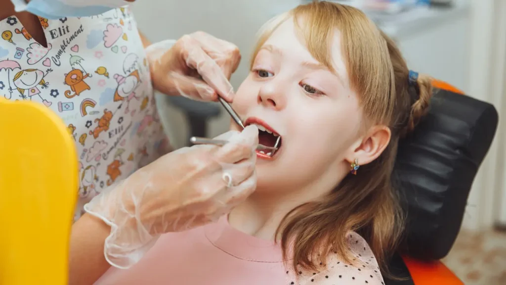 Girl child receiving a dental filling treatment in Dubai