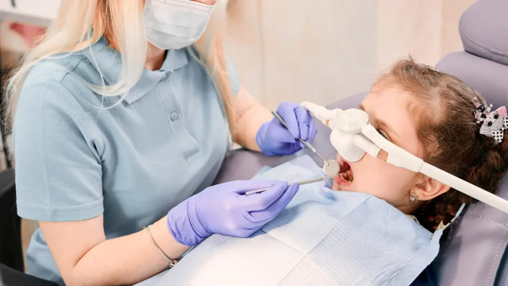 Child receiving dental treatment with anesthesia support at a pediatric dental clinic in Dubai
