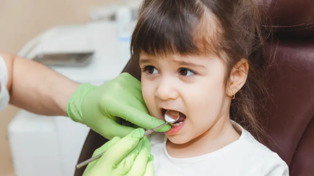 Child having a pediatric dental checkup in Dubai