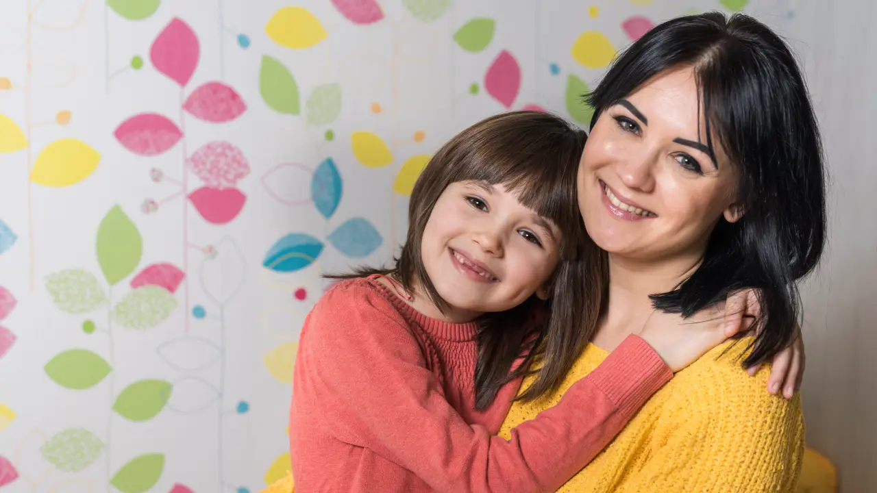 Mother and daughter together illustrating the question of whether cavities are genetic